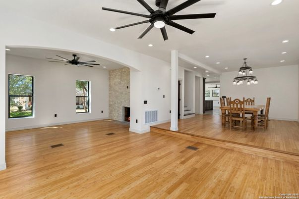Dining room, Fireplace, Interior, Pendant Lights, Recessed Lighting, Stone Walls, Wood Texture Flooring