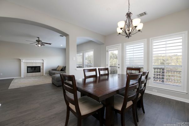 Chandelier, Dining room, Fireplace, Interior, Recessed Lighting, Wood Texture Flooring