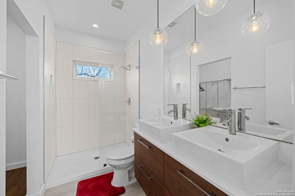 Bathroom, Dual Sink Vanities, Glass Shower, Interior, Pendant Lights, Recessed Lighting, Wood Texture Flooring
