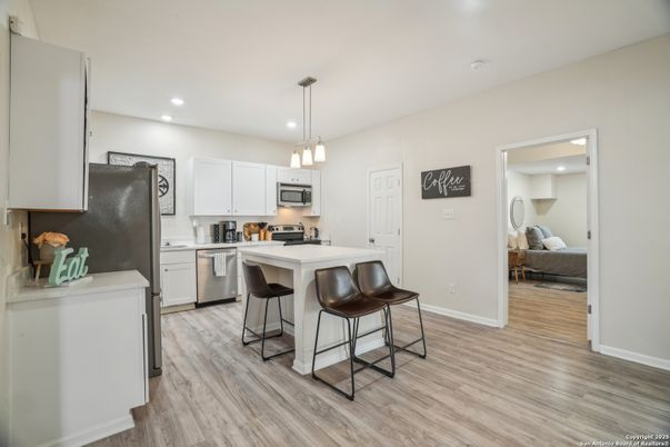 Interior, Kitchen, Pendant Lights, Recessed Lighting, Stainless Steel Appliances, Wood Texture Flooring