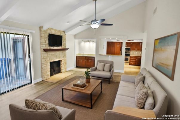 Fireplace, Interior, Living room, Recessed Lighting, Stone Walls, Wood Texture Flooring