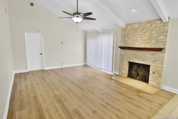 Empty room, Fireplace, Interior, Recessed Lighting, Stone Walls, Wood Texture Flooring