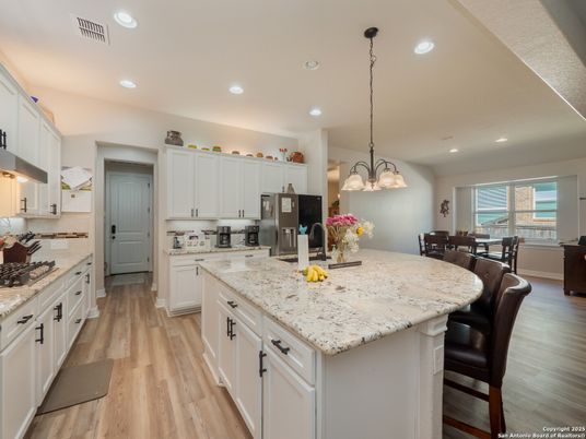 Dining room, Interior, Kitchen, Pendant Lights, Recessed Lighting, Stainless Steel Appliances, Wood Texture Flooring