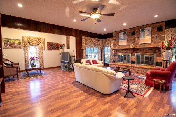 Fireplace, Interior, Living room, Recessed Lighting, Stone Walls, Wood Texture Flooring