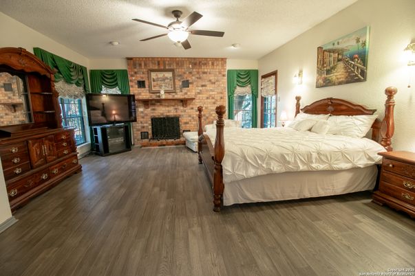 Bedroom, Fireplace, Interior, Stone Walls, Wood Texture Flooring