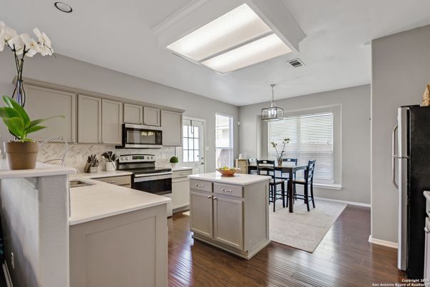 Dining room, Interior, Kitchen, Pendant Lights, Recessed Lighting, Stainless Steel Appliances, Wood Texture Flooring