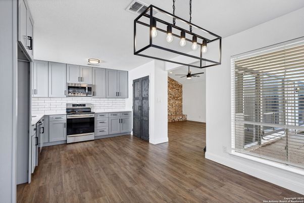 Interior, Kitchen, Pendant Lights, Stainless Steel Appliances, Stone Walls, Wood Texture Flooring