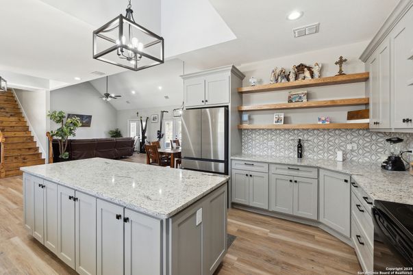 Dining room, Interior, Kitchen, Pendant Lights, Recessed Lighting, Stainless Steel Appliances, Wood Texture Flooring