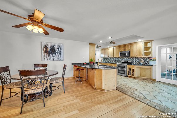 Dining room, Interior, Kitchen, Recessed Lighting, Stainless Steel Appliances, Wood Texture Flooring