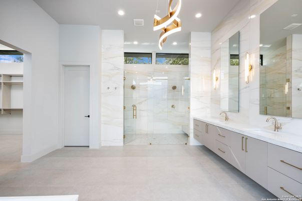 Bathroom, Dual Sink Vanities, Glass Shower, Interior, Marble Walls, Pendant Lights, Recessed Lighting