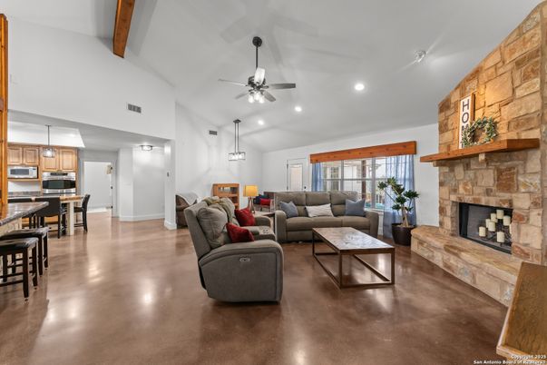 Dining room, Fireplace, Interior, Kitchen, Living room, Pendant Lights, Recessed Lighting, Stainless Steel Appliances, Stone Walls, Wooden Beams