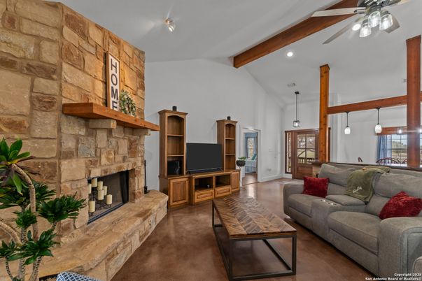 Fireplace, Interior, Living room, Pendant Lights, Recessed Lighting, Stone Walls, Wooden Beams