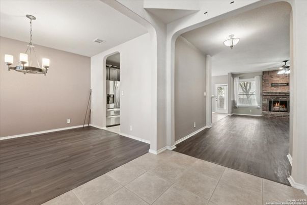 Chandelier, Empty room, Fireplace, Interior, Kitchen, Pendant Lights, Wood Texture Flooring