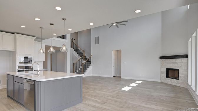 Fireplace, Interior, Kitchen, Pendant Lights, Recessed Lighting, Wood Texture Flooring