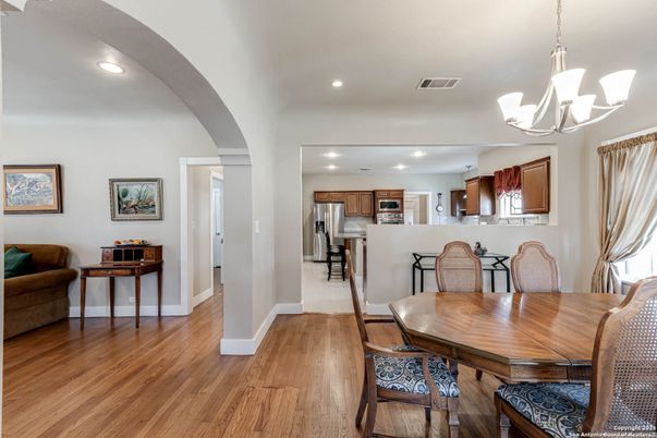 Dining room, Interior, Kitchen, Pendant Lights, Recessed Lighting, Stainless Steel Appliances, Wood Texture Flooring
