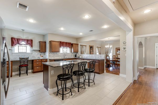 Chandelier, Dining room, Interior, Kitchen, Pendant Lights, Recessed Lighting, Stainless Steel Appliances, Wood Texture Flooring