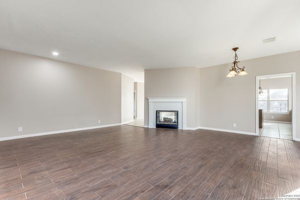 Empty room, Fireplace, Interior, Pendant Lights, Recessed Lighting, Wood Texture Flooring