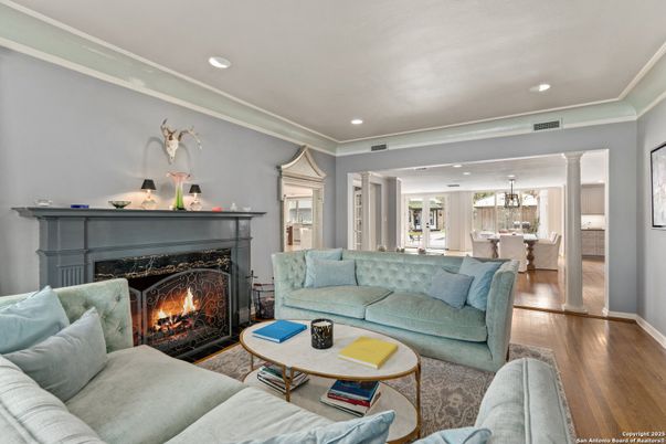 Chandelier, Dining room, Fireplace, Interior, Living room, Pendant Lights, Recessed Lighting, Wood Texture Flooring