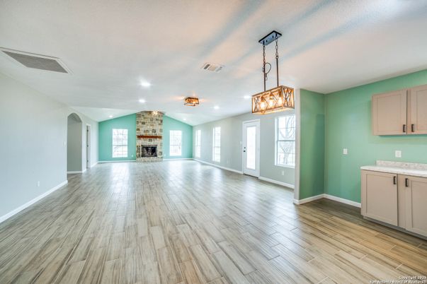 Empty room, Fireplace, Interior, Pendant Lights, Recessed Lighting, Wood Texture Flooring