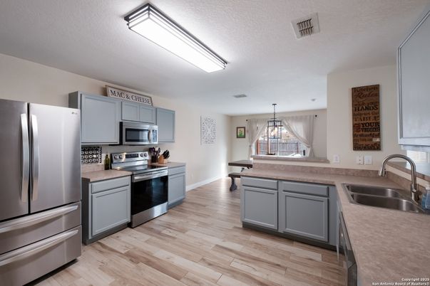 Chandelier, Interior, Kitchen, Pendant Lights, Stainless Steel Appliances, Wood Texture Flooring