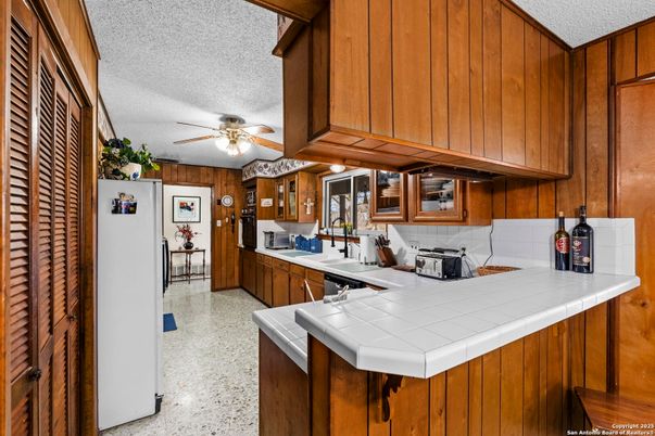 Interior, Kitchen, Tile Countertops, Wooden Walls