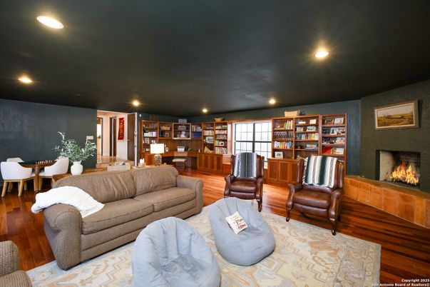 Dining room, Fireplace, Interior, Living room, Recessed Lighting, Wood Texture Flooring