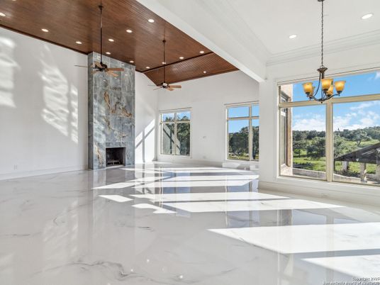 Empty room, Fireplace, Interior, Marble, Pendant Lights, Recessed Lighting, Wooden Ceilings