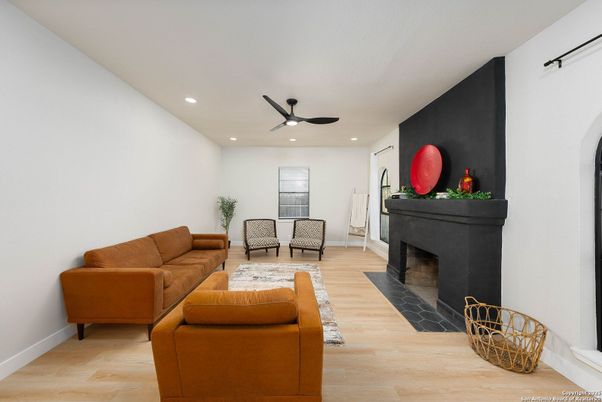 Dining room, Fireplace, Interior, Living room, Recessed Lighting, Wood Texture Flooring