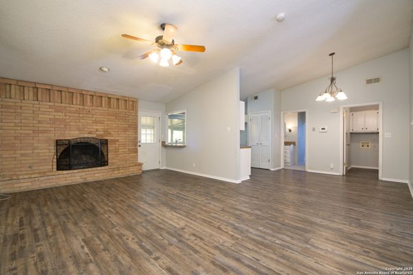 Empty room, Fireplace, Interior, Pendant Lights, Stone Walls, Wood Texture Flooring