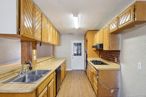 Interior, Kitchen, Tile Countertops, Wood Texture Flooring