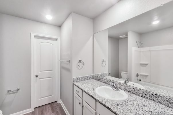 Bathroom, Dual Sink Vanities, Interior, Recessed Lighting, Wood Texture Flooring