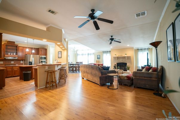 Dining room, Fireplace, Interior, Kitchen, Living room, Pendant Lights, Recessed Lighting, Stainless Steel Appliances, Wood Texture Flooring