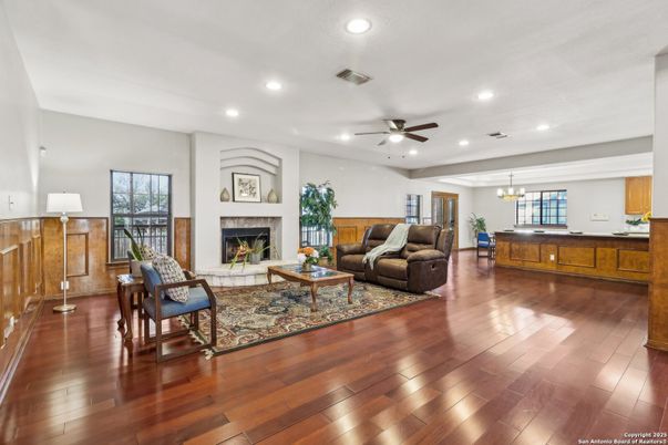 Chandelier, Fireplace, Interior, Living room, Pendant Lights, Recessed Lighting, Wood Texture Flooring