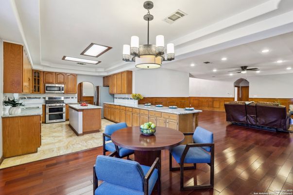 Dining room, Interior, Kitchen, Pendant Lights, Recessed Lighting, Stainless Steel Appliances, Wood Texture Flooring
