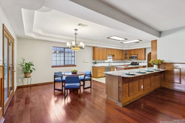 Chandelier, Dining room, Interior, Kitchen, Pendant Lights, Stainless Steel Appliances, Wood Texture Flooring