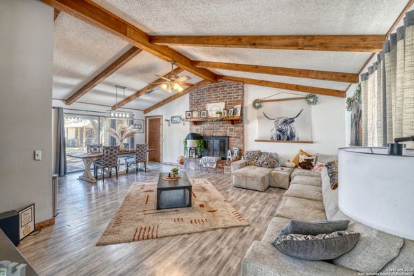 Dining room, Fireplace, Interior, Living room, Stone Walls, Wooden Beams, Wood Texture Flooring