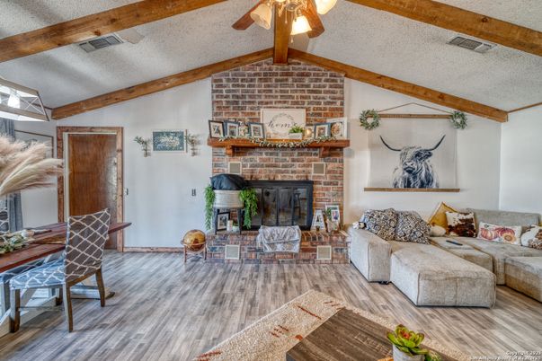 Dining room, Fireplace, Interior, Living room, Stone Walls, Wooden Beams, Wood Texture Flooring