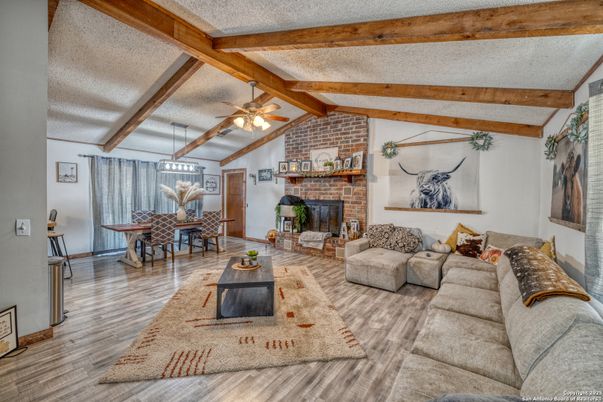 Dining room, Fireplace, Interior, Living room, Stone Walls, Wooden Beams, Wood Texture Flooring