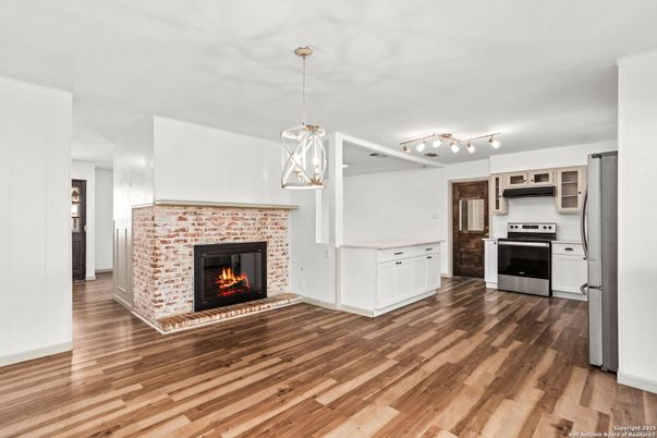 Fireplace, Interior, Kitchen, Pendant Lights, Stainless Steel Appliances, Wood Texture Flooring