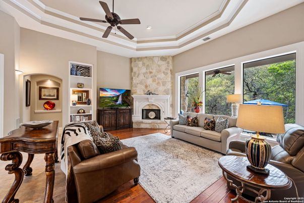 Fireplace, Interior, Living room, Recessed Lighting, Stone Walls, Wood Texture Flooring