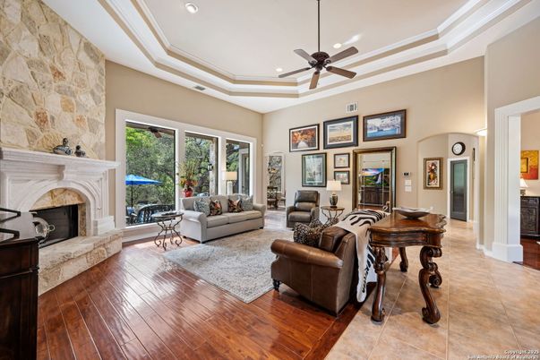 Fireplace, Interior, Living room, Recessed Lighting, Stone Walls, Wood Texture Flooring