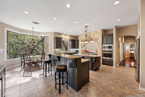 Dining room, Interior, Kitchen, Pendant Lights, Recessed Lighting, Stainless Steel Appliances, Wood Texture Flooring