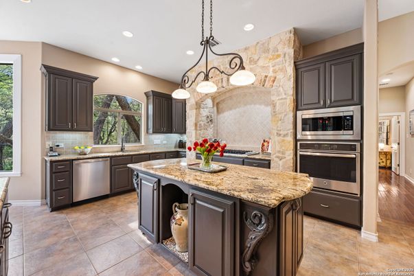 Interior, Kitchen, Pendant Lights, Recessed Lighting, Stainless Steel Appliances, Stone Walls, Wood Texture Flooring