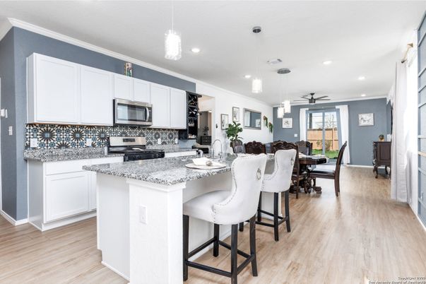 Dining room, Interior, Kitchen, Pendant Lights, Recessed Lighting, Stainless Steel Appliances, Wood Texture Flooring