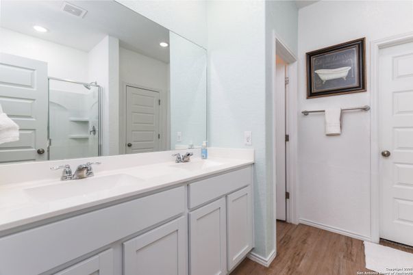 Bathroom, Dual Sink Vanities, Interior, Recessed Lighting, Wood Texture Flooring