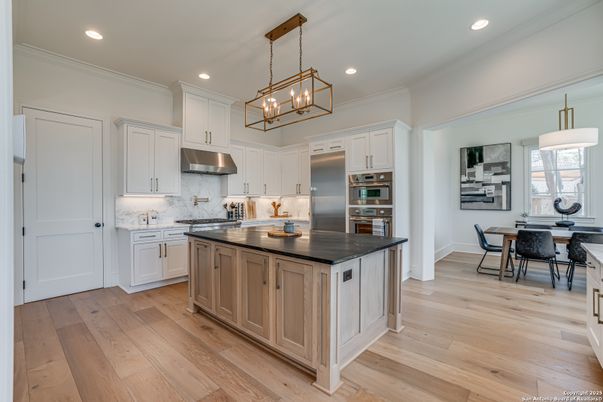 Dining room, Interior, Kitchen, Pendant Lights, Recessed Lighting, Stainless Steel Appliances, Wood Texture Flooring