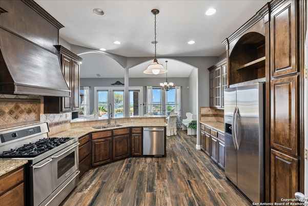 Chandelier, Interior, Kitchen, Pendant Lights, Recessed Lighting, Stainless Steel Appliances, Wood Texture Flooring