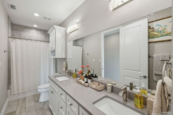 Bathroom, Dual Sink Vanities, Interior, Recessed Lighting, Wood Texture Flooring
