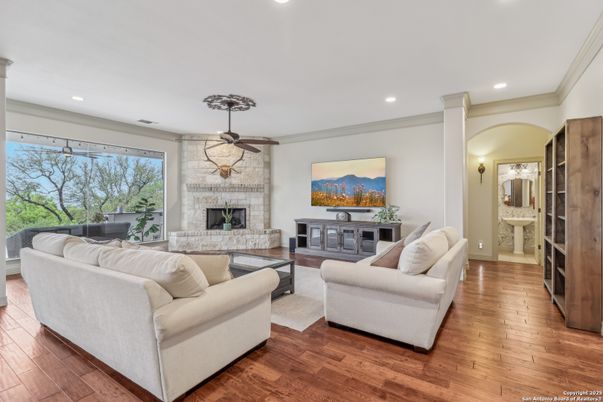 Fireplace, Interior, Living room, Recessed Lighting, Stone Walls, Wood Texture Flooring