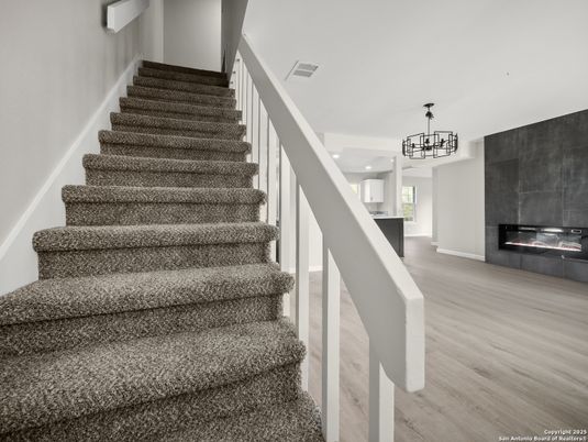 Fireplace, Interior, Pendant Lights, Recessed Lighting, Wood Texture Flooring